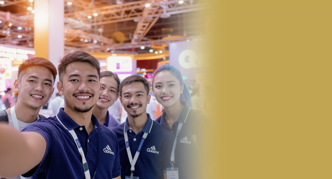 A team of five employees taking a selfie together at a conference.
